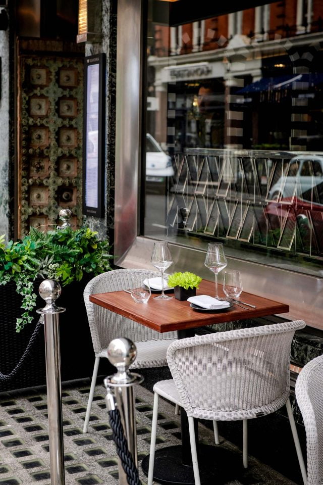 The elegant, brightly designed interior dining room at Kanishka in Mayfair, London.