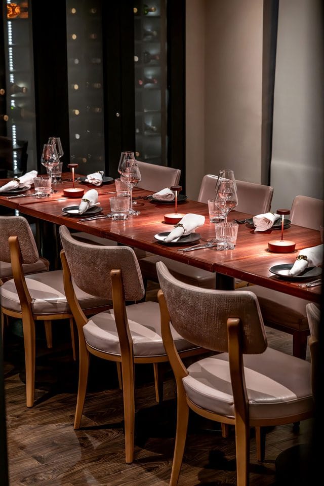 Beautifully decorated private dining room set up for a corporate event at Kanishka.